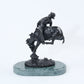 The Outlaw bronze sculpture replica statue by Frederic Remington cowboy on a bucking horse saddle breaking back
