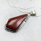 Pear Shaped Cuprite Pendant Necklace with Tooled Setting