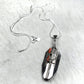 Prayer Feather Pendant Necklace with Noble Coral Baguette Inlay by Mathilda Benally