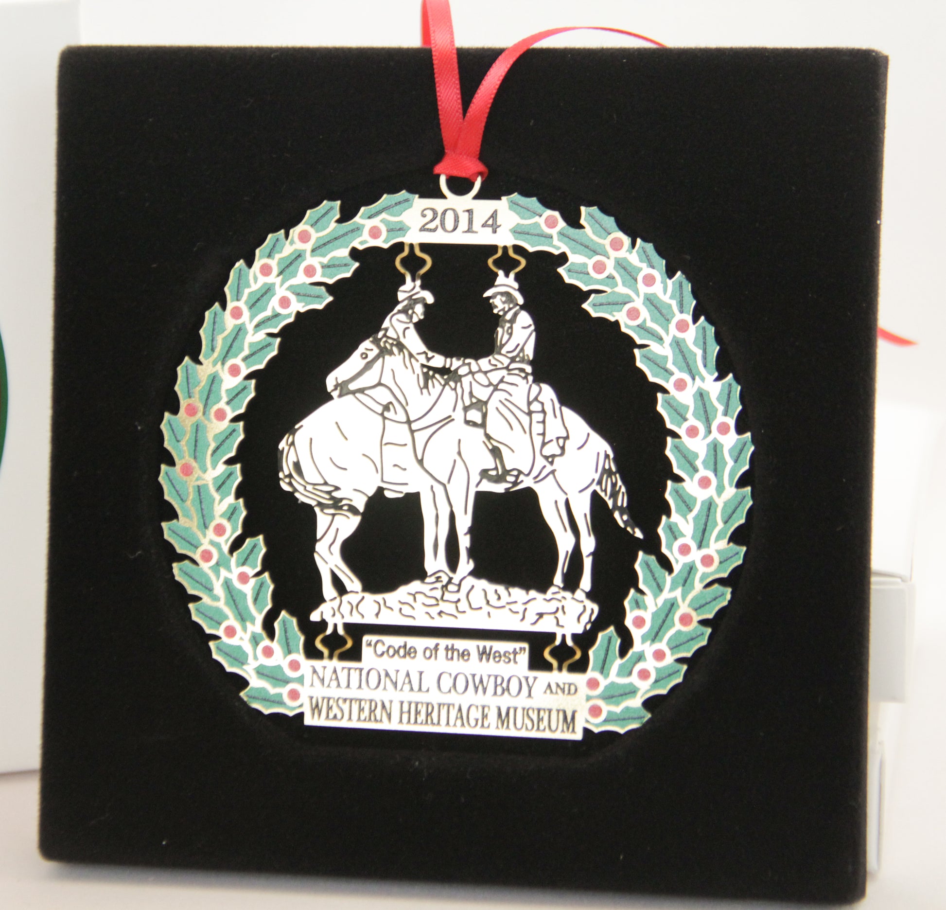 code of the west christmas ornament 2014 national cowboy museum store annual holiday ornament two cowboys on horses gold metal delicate stamped
